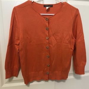 A lady’s sweater size M